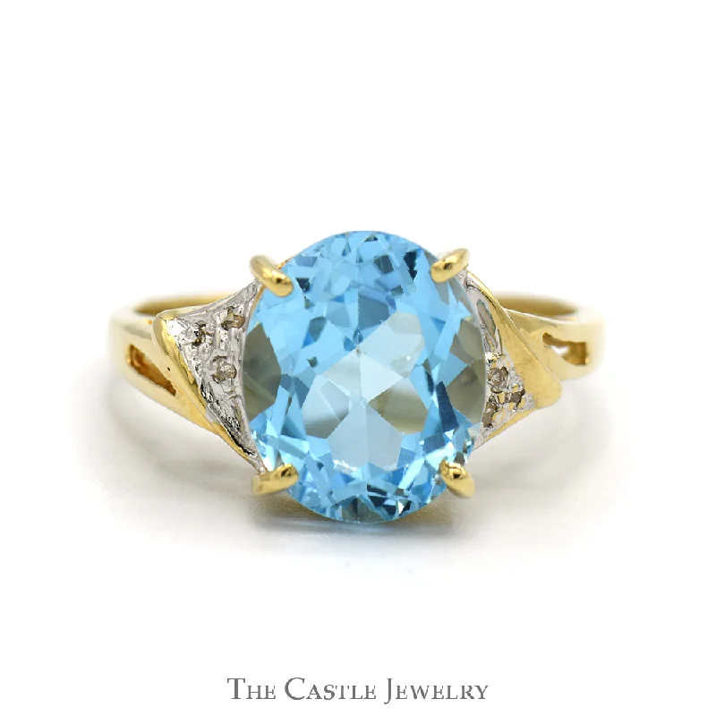 ladies rings bold design -Oval Blue Topaz Ring with Diamond Accented Sides in 10k Yellow Gold