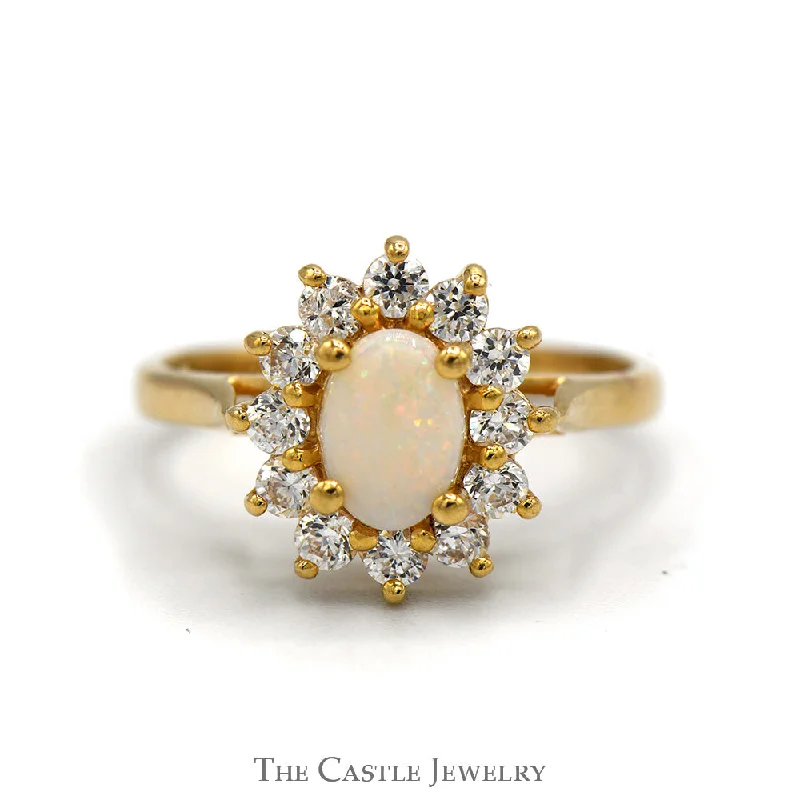 ladies rings dainty look -Oval Opal Ring with Cubic Zirconia Halo in 14k Yellow Gold