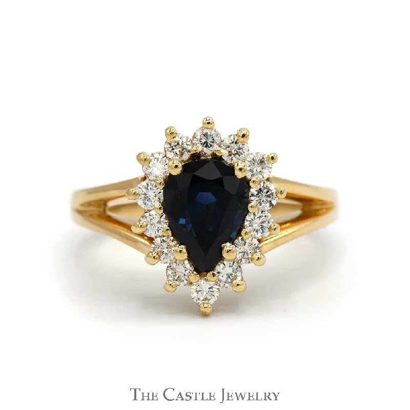 ladies rings with blue sapphire -Pear Cut Sapphire Ring with Diamond Halo in 14k Yellow Gold Split Shank Setting